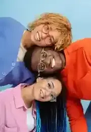 Three smiling friends wearing Mannys Eyewear glasses
